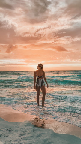 Woman on Emerald Coast beach